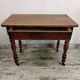 Antique wooden desk with a drawer.