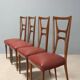 Set of six 1950s chairs with burgundy seats.