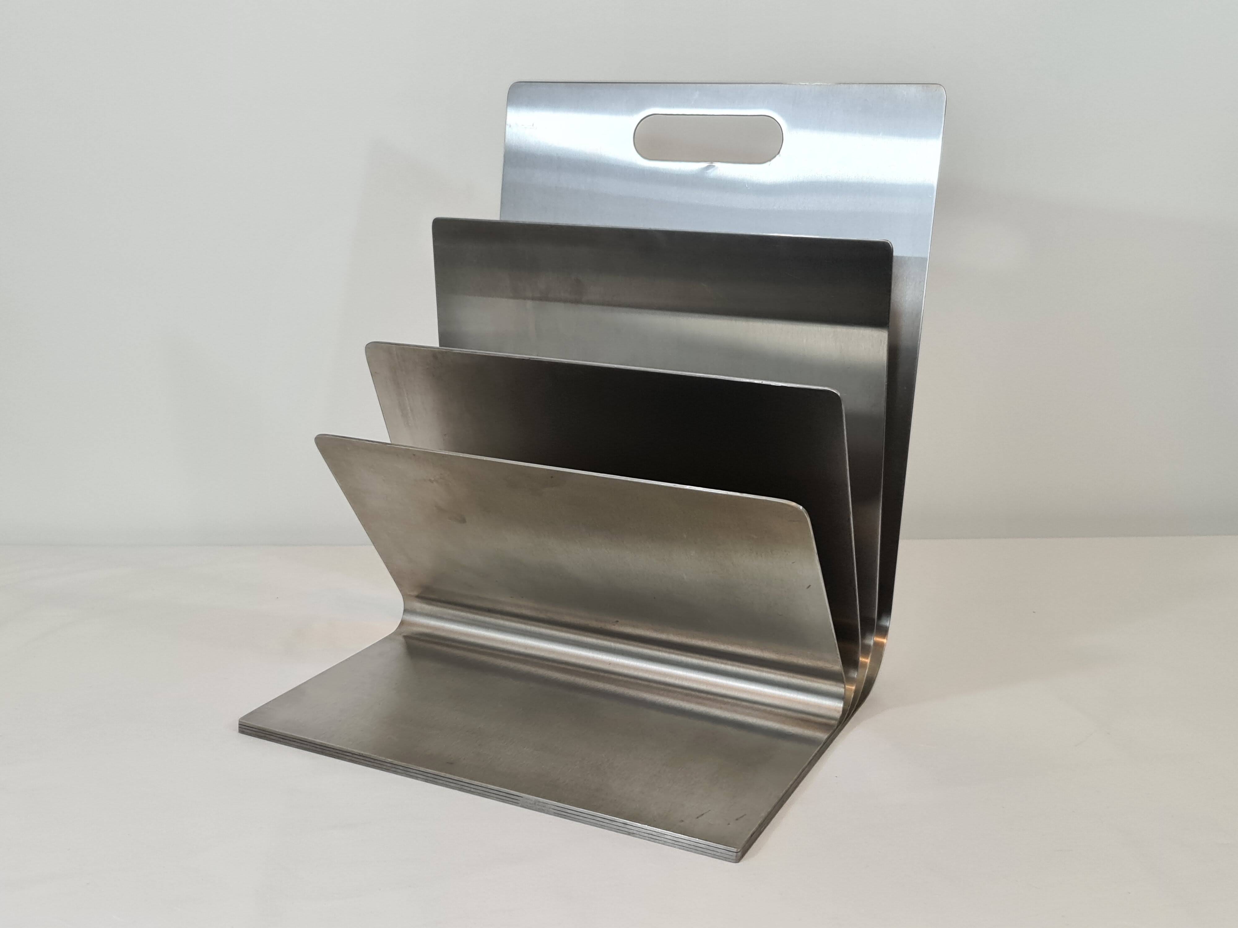 Stainless steel magazine rack by Xavier Féal for Inox Industrie 1970s