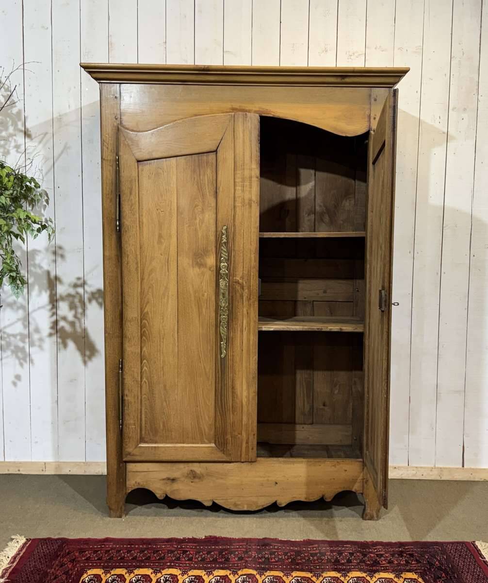19th-century country wardrobe in blonde chestnut.