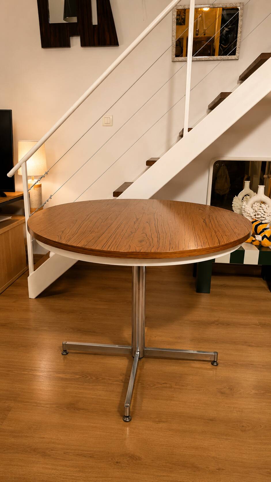 Extendable round table with a space age vintage mid-century formica top.