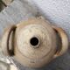 Old terracotta pot with two handles