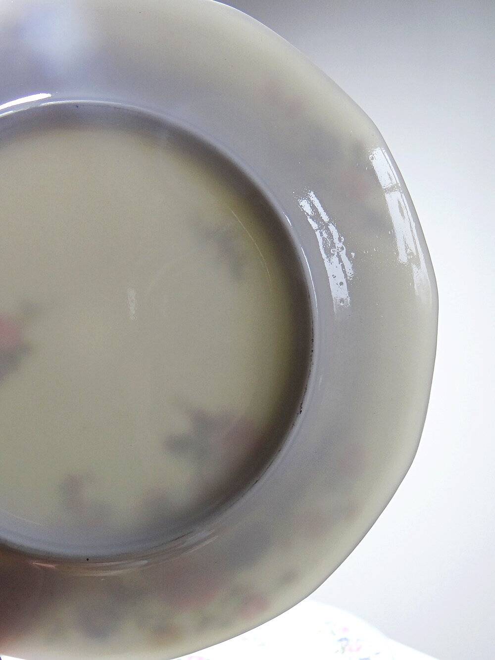 7 assiettes à dessert Bernardaud en porcelaine de Limoges décor floral, années 20-50