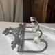Patinated metal wall bracket and porcelain