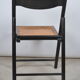 Folding chair seated in cannage