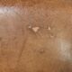 Vintage sheepskin club armchair finished with decorative nails