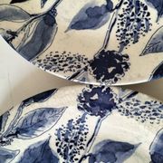 Two flat plates in earthenware with blue floral decoration.
