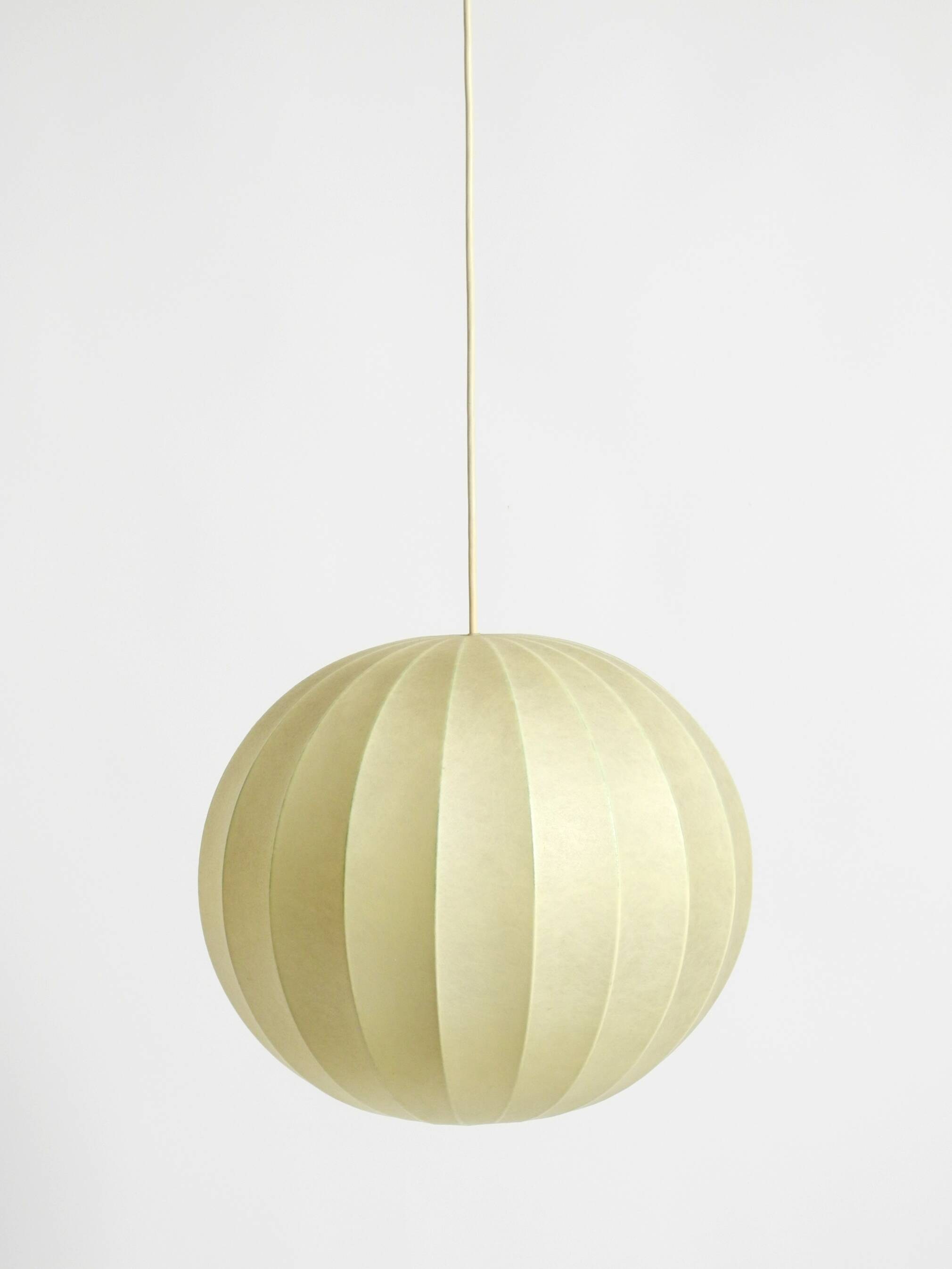 Beautiful Cocoon pendant lamp in very good vintage condition from the 1960s