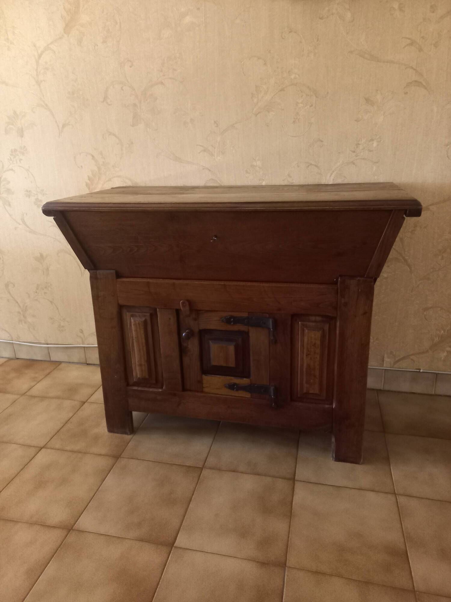 Old solid wood dough mixer carefully transformed into a bar cabinet.