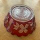 Red and transparent glass bowl with floral motifs and vintage wheat cobs