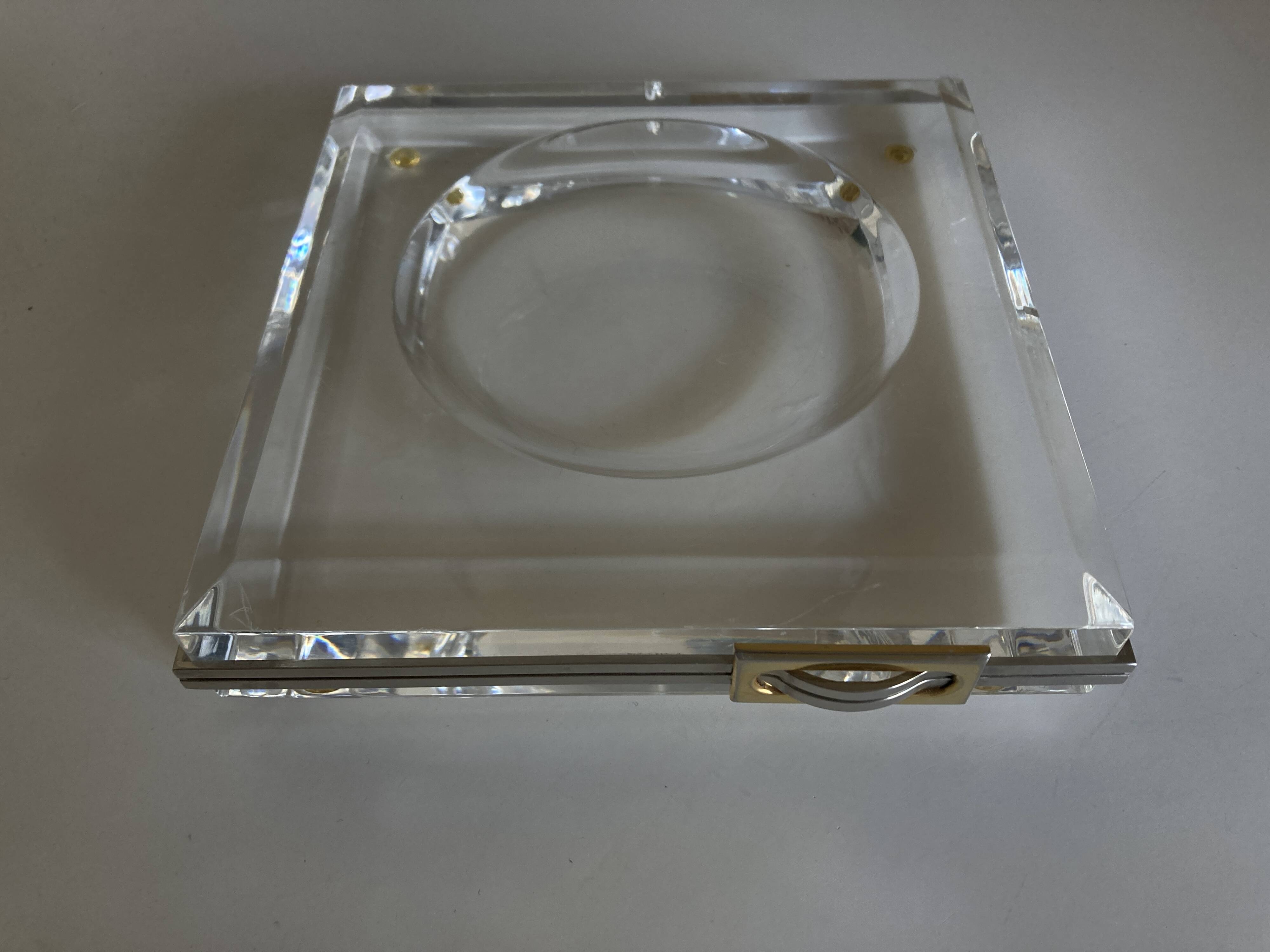 Plexiglas pocket emptier with brass and nickel silver surround, 1975, in the style of Pergay