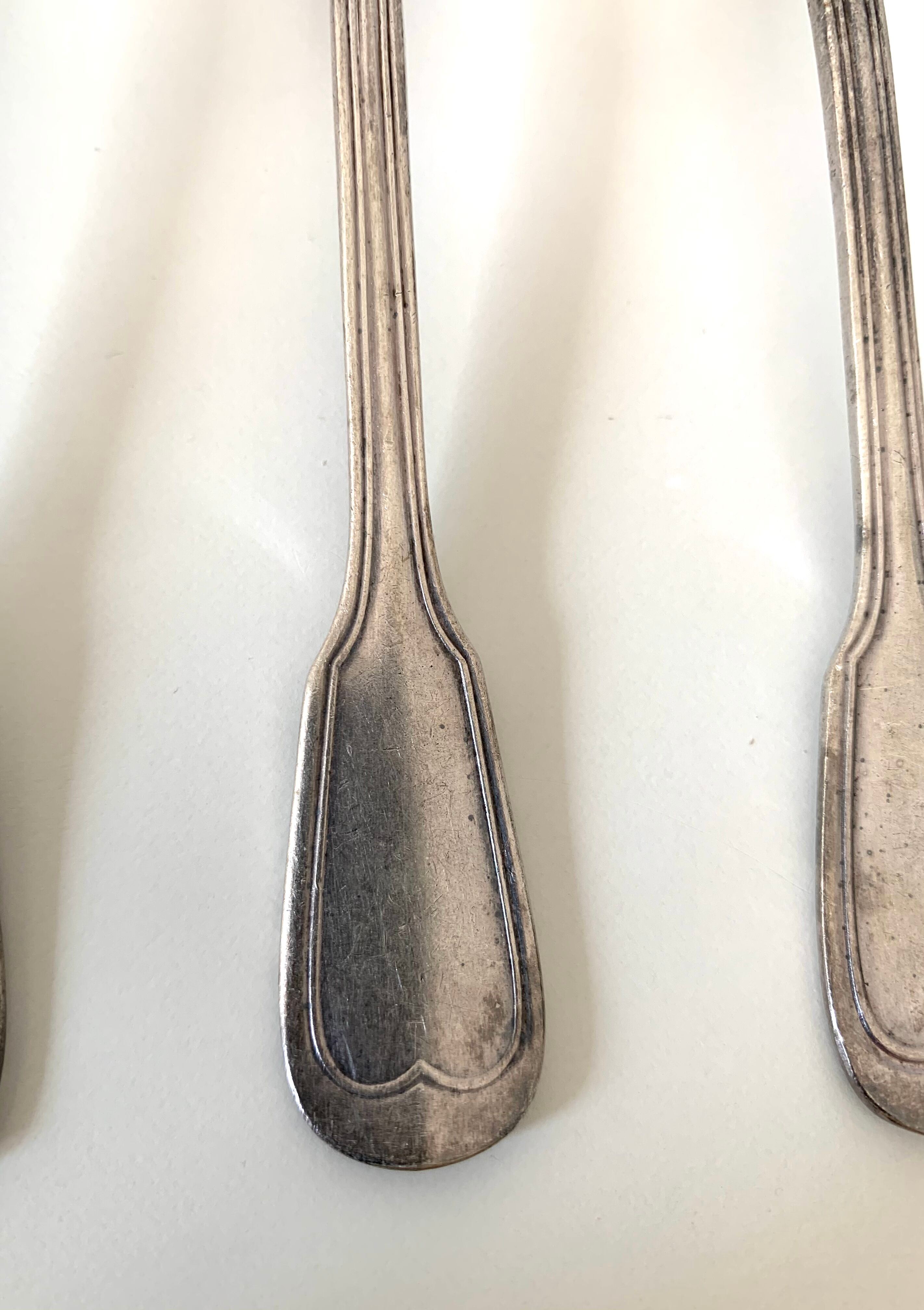 8 silver metal spoons