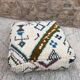 Berber floor pouf: Handwoven Moroccan wool cushion.
