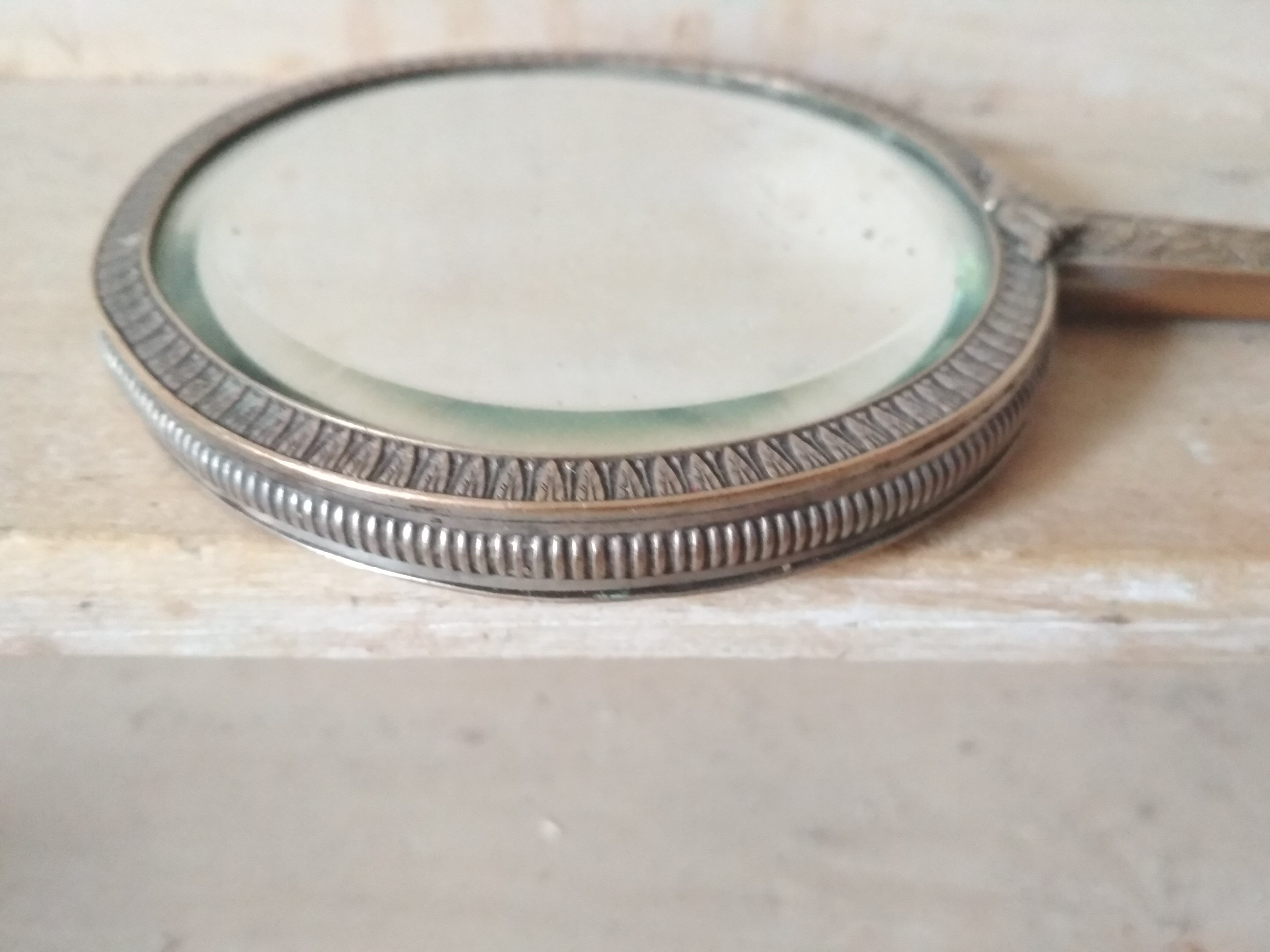 Old hand mirror beveled glass