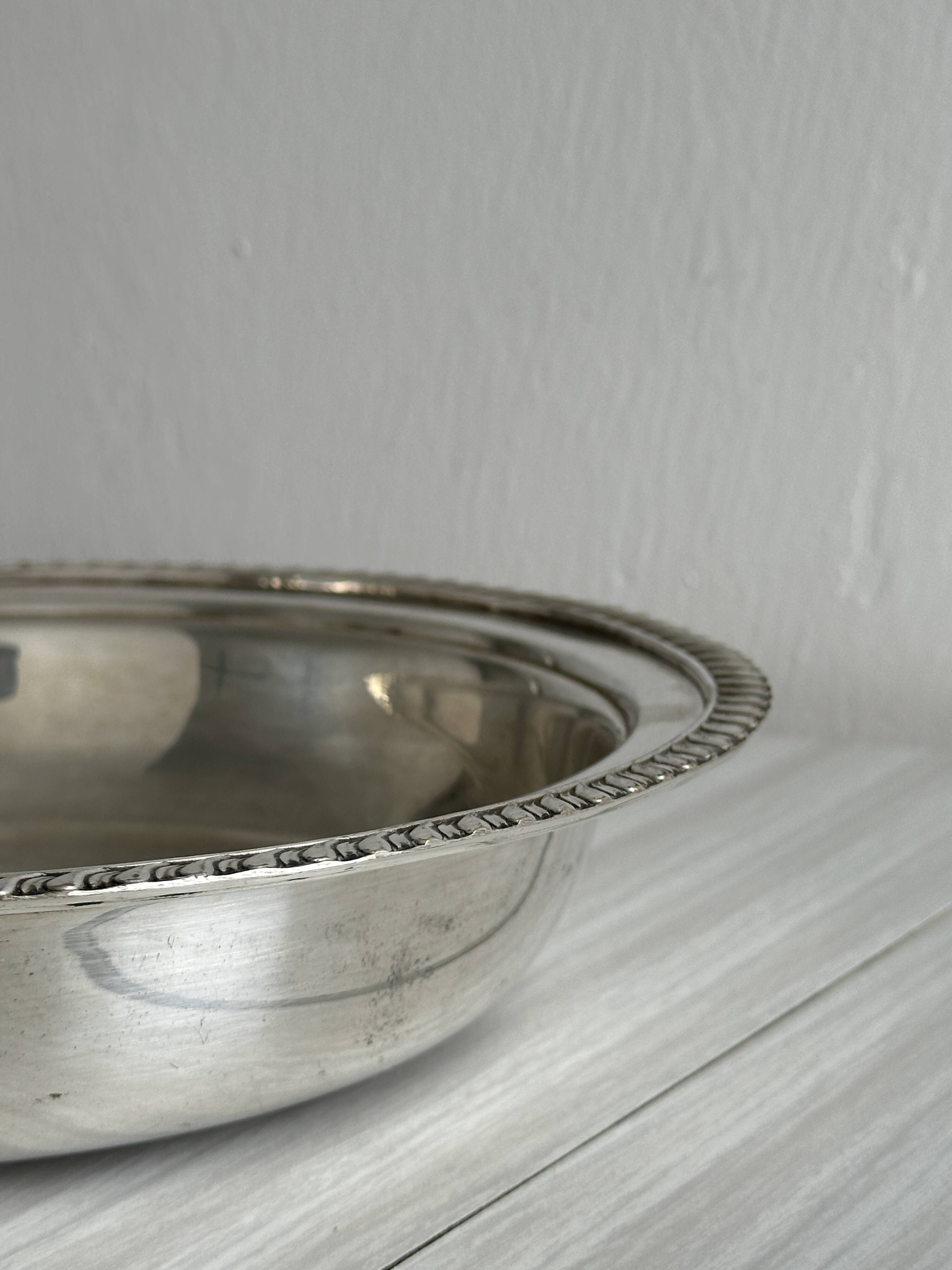 Antique round salad bowl or dish in shiny silver metal