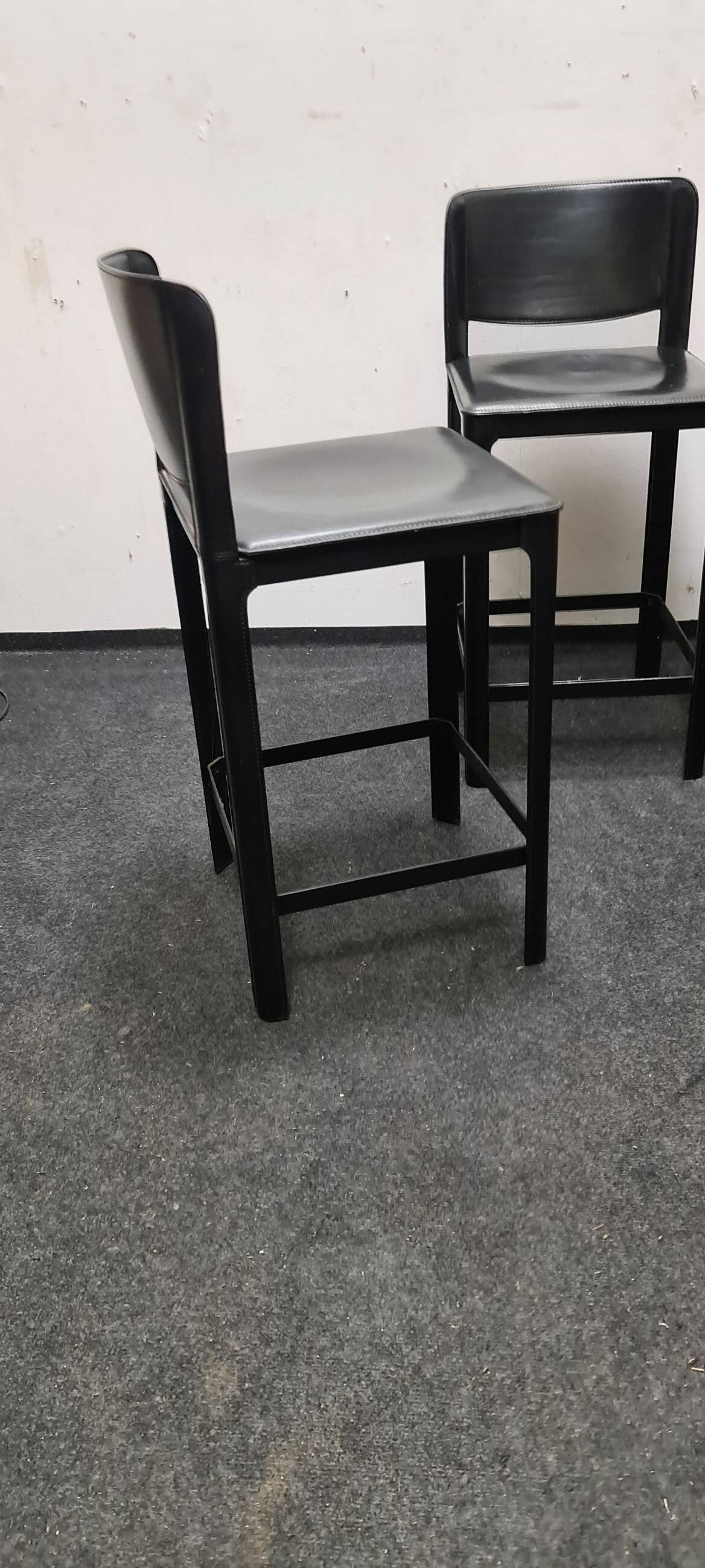 A set of four Italian leather bar stools by Matteo Grassi