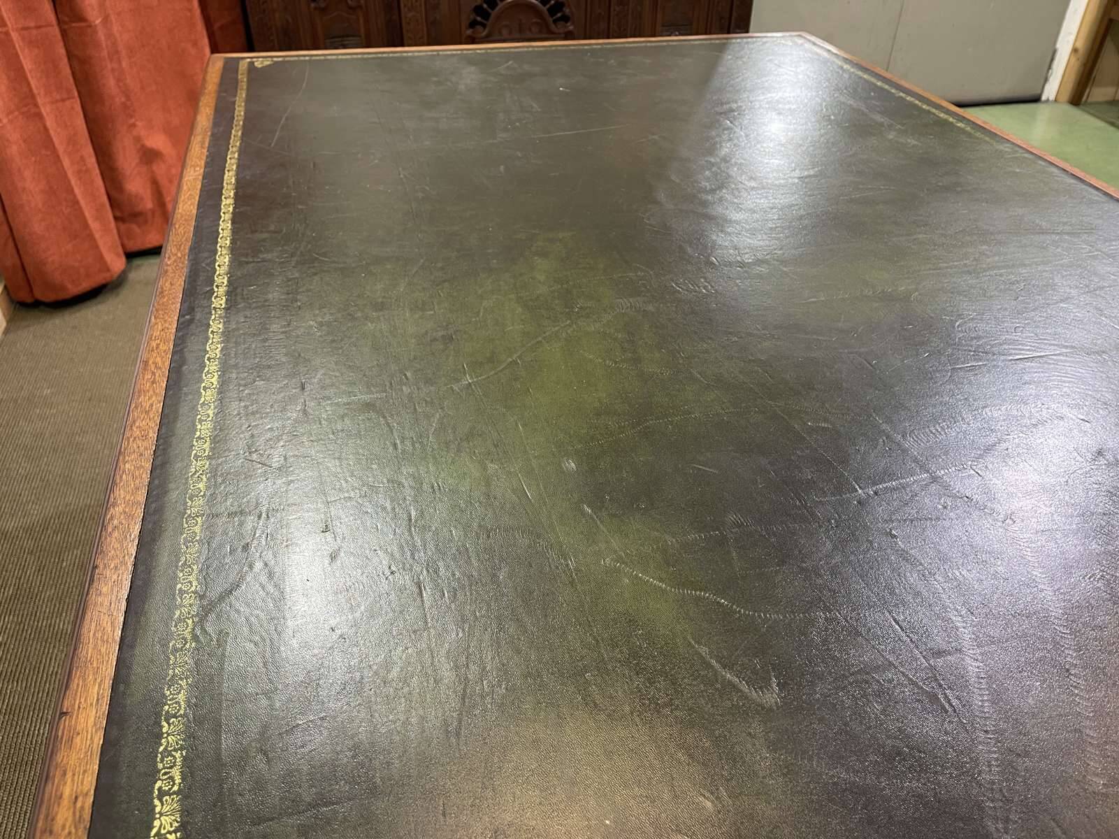 Large English flat desk in mahogany with leather top, early 20th century