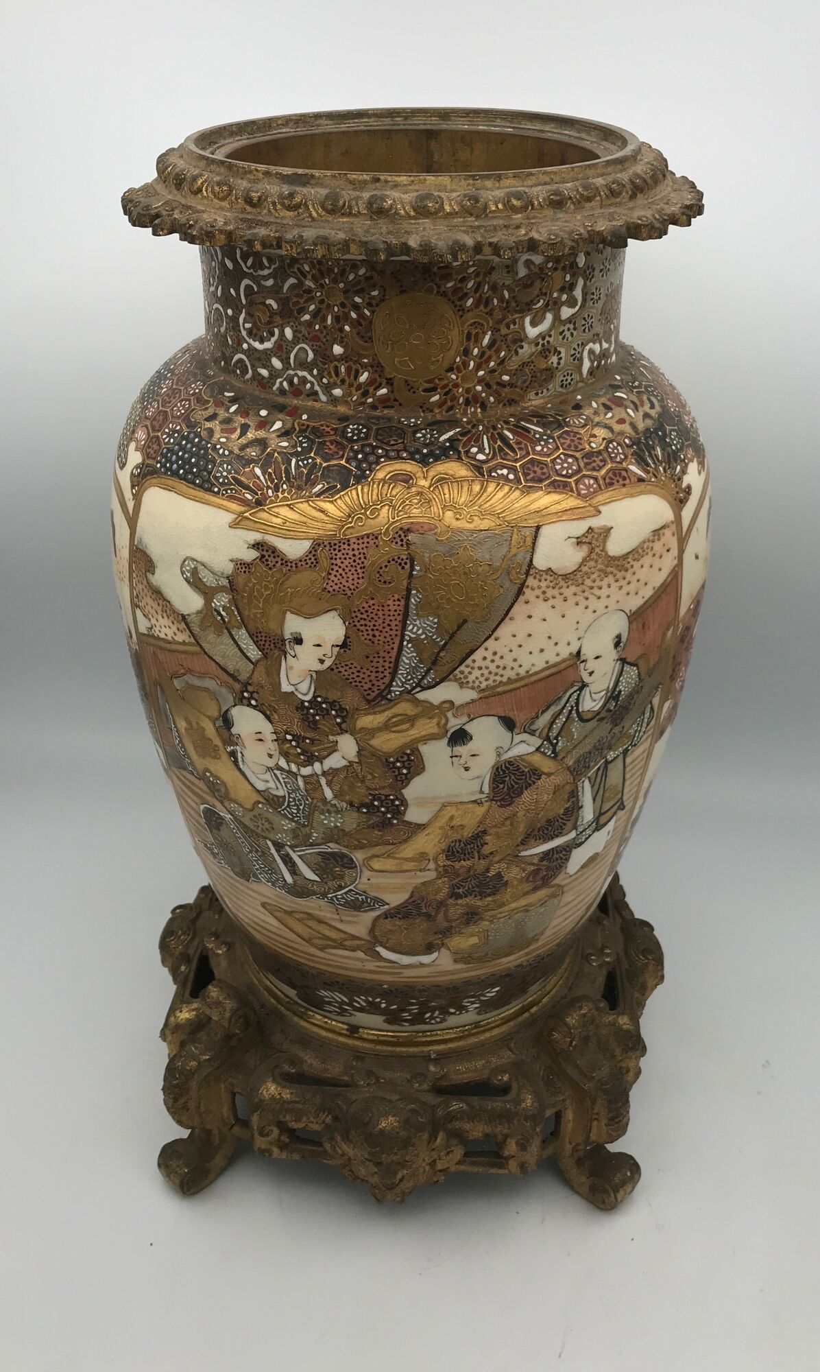 Old satsuma ceramic vase with various decorations mounted on bronze