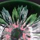 Green faience bowl decorated with multicolored drips around 1970