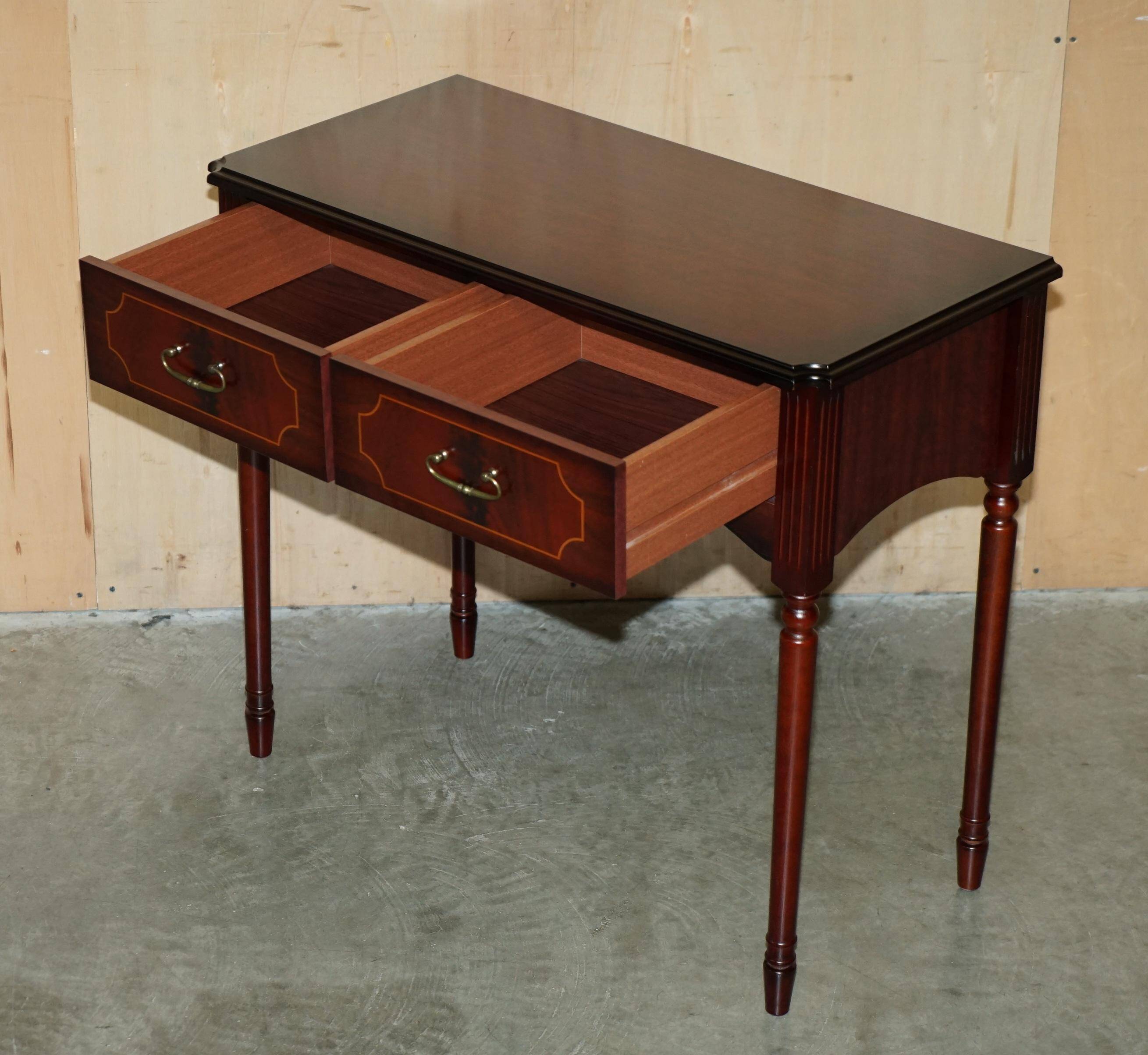 Small console with two drawers in hardwood finish.