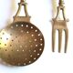 Brass and wood kitchen utensils with wall display, 60s