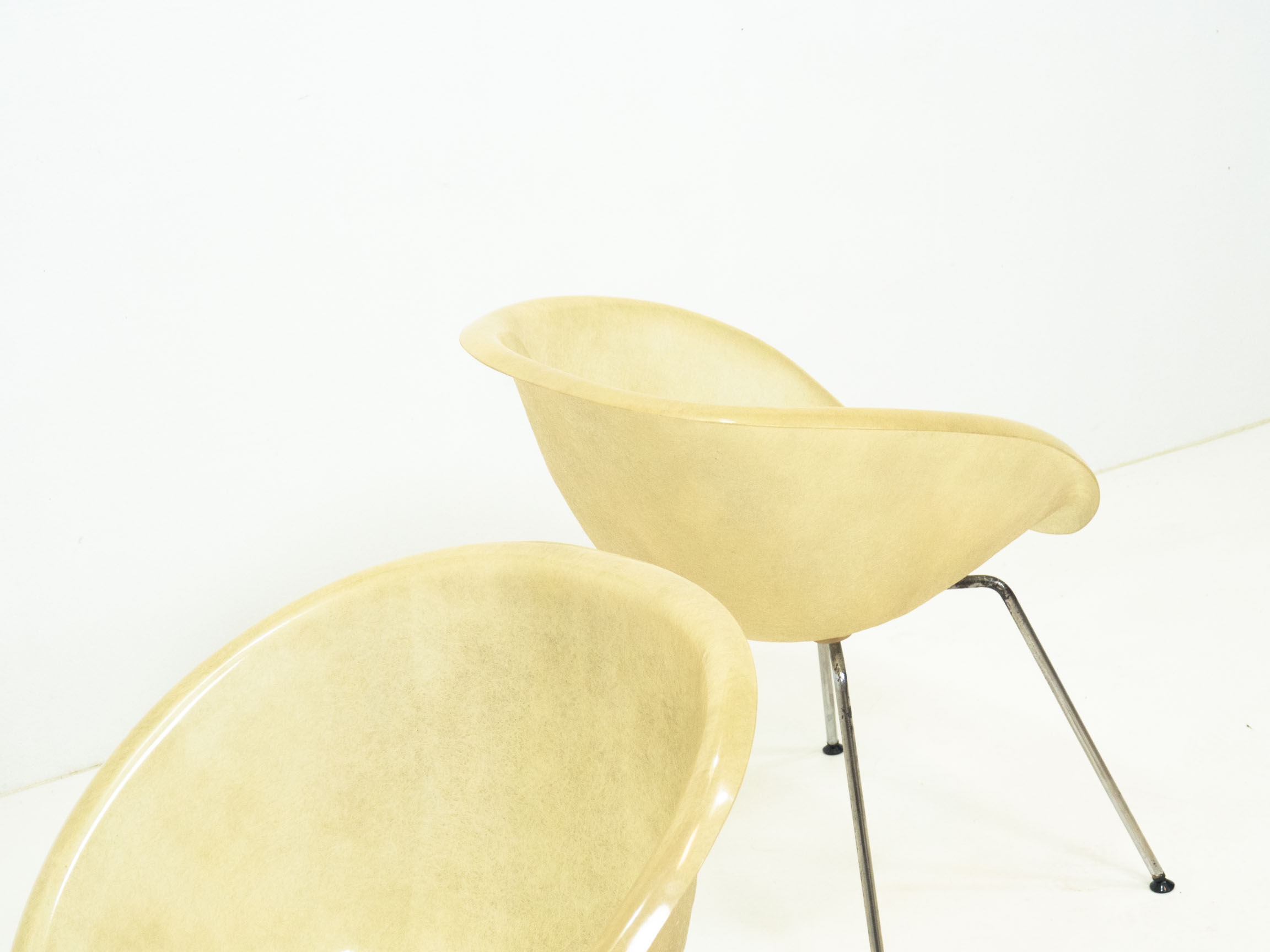 Set of two vintage fiber glass shell chairs