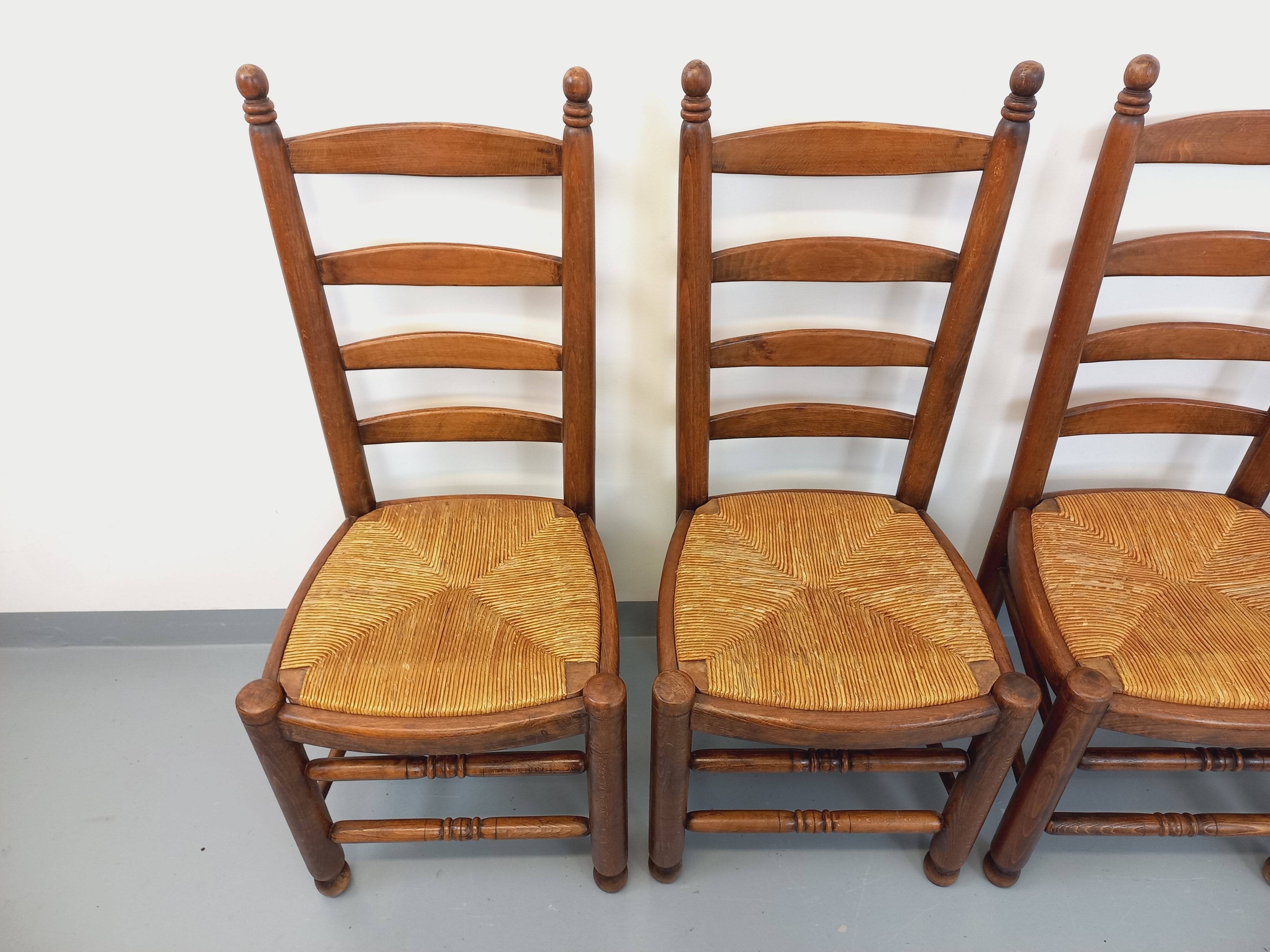 Set of 4 vintage brutalist Charles Dudouyt chairs in wood and straw from the 60s