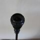 Table lamp with a patinated base and vintage woven shade.