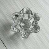 Empty pocket ashtray in transparent crystal organic shape.