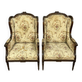 Large pair of Louis XVI style carved wooden wingback armchairs