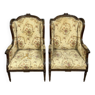 Large pair of Louis XVI style carved wooden wingback armchairs