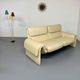 Two-seater designer sofa De Sede DS-2011 in cream leather with adjustable backrest.
