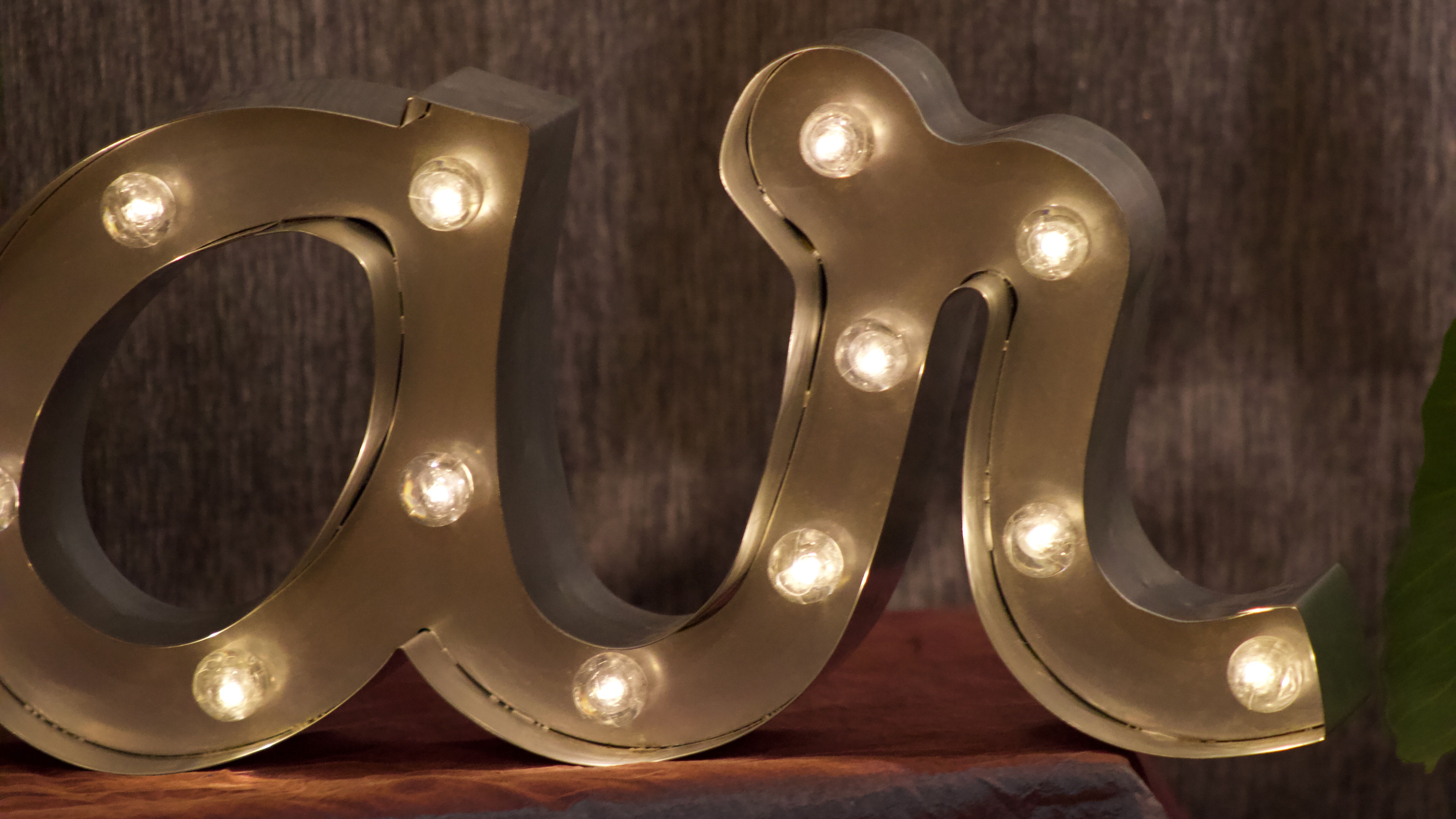 Ancient Light Sign in aluminium lettering forming the word "BAR"