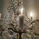 A pair of imposing, antique chandeliers with pendants.