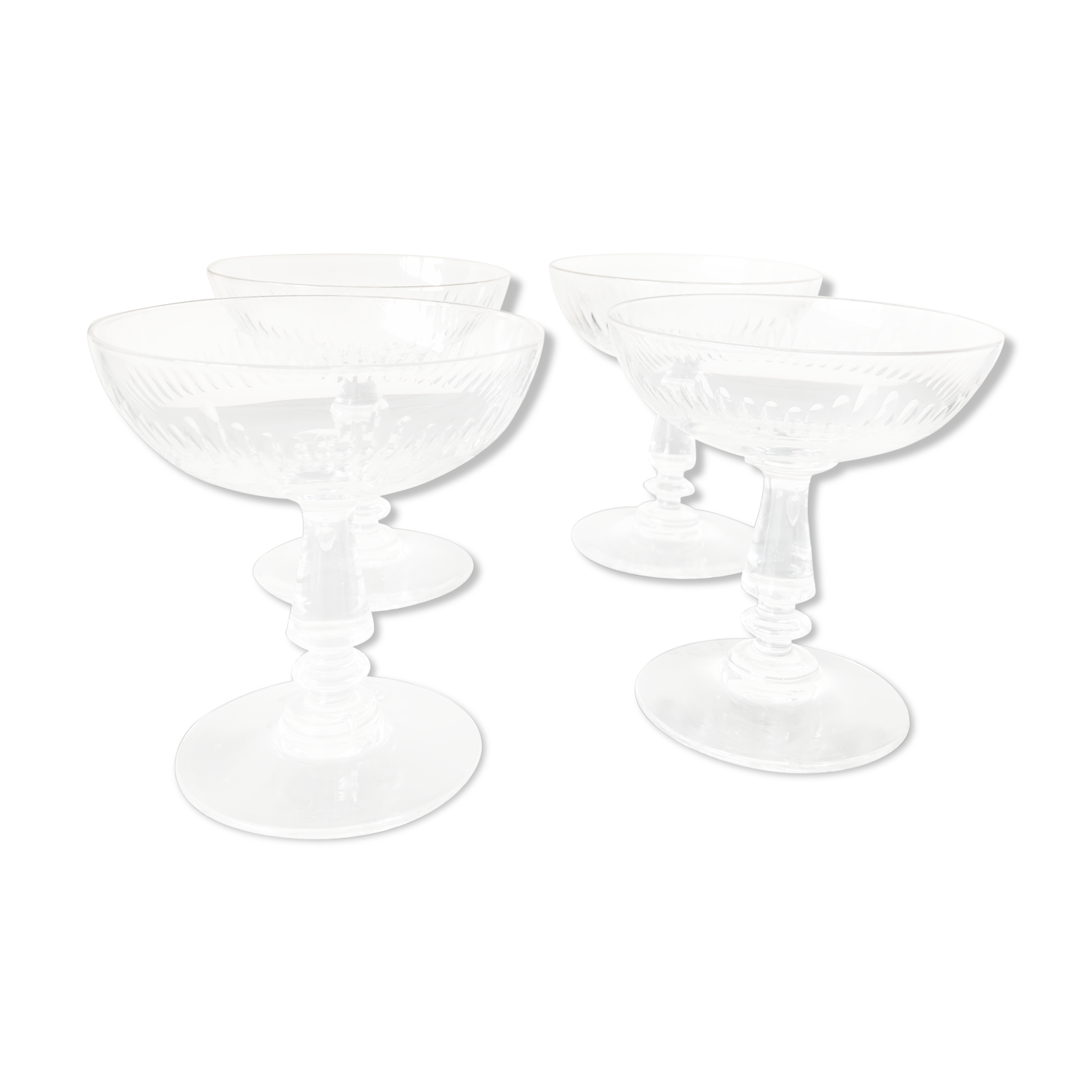 4 glasses of carved crystal champagne