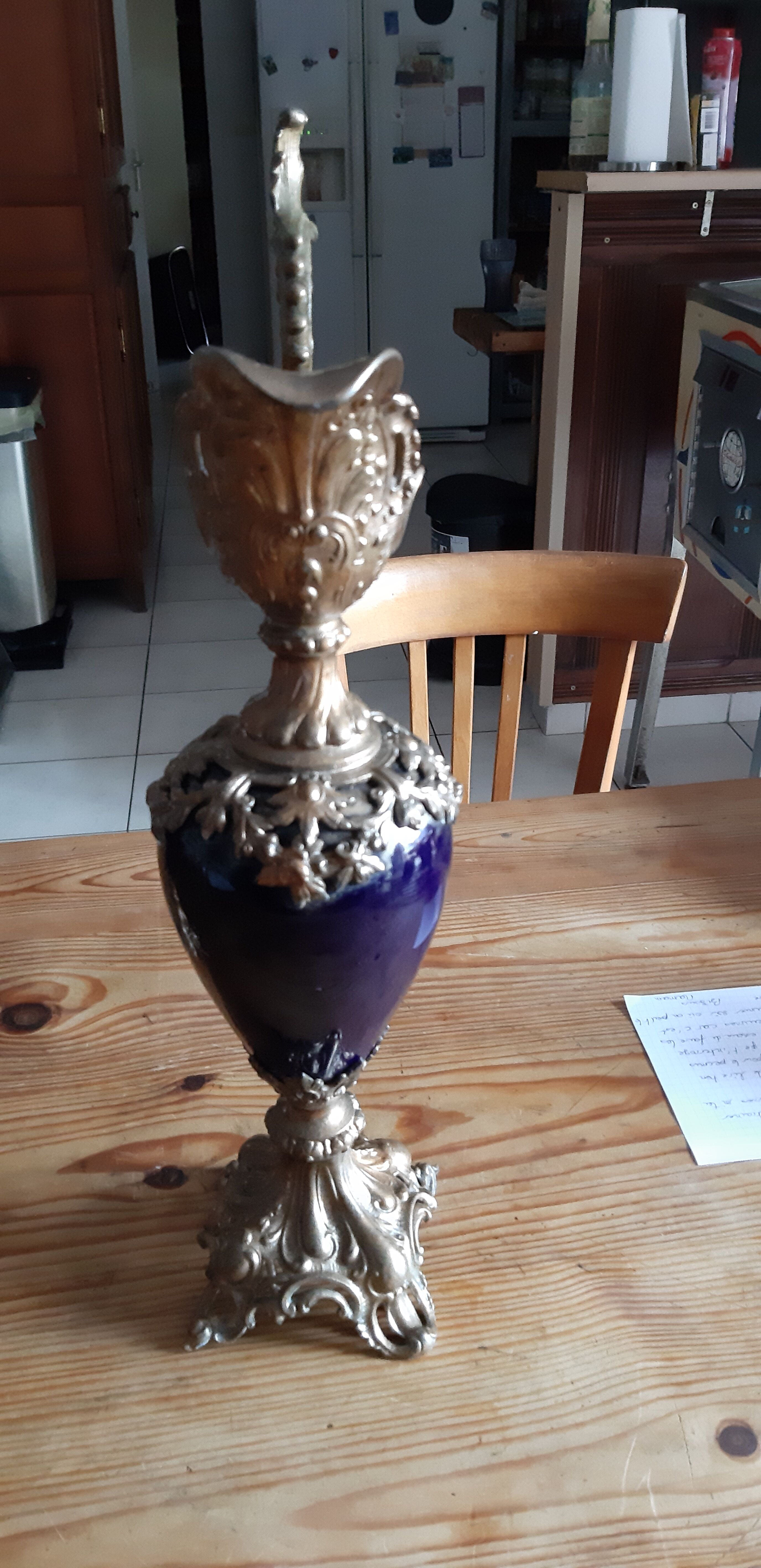 Pair of golden regulated ewers and blue glass