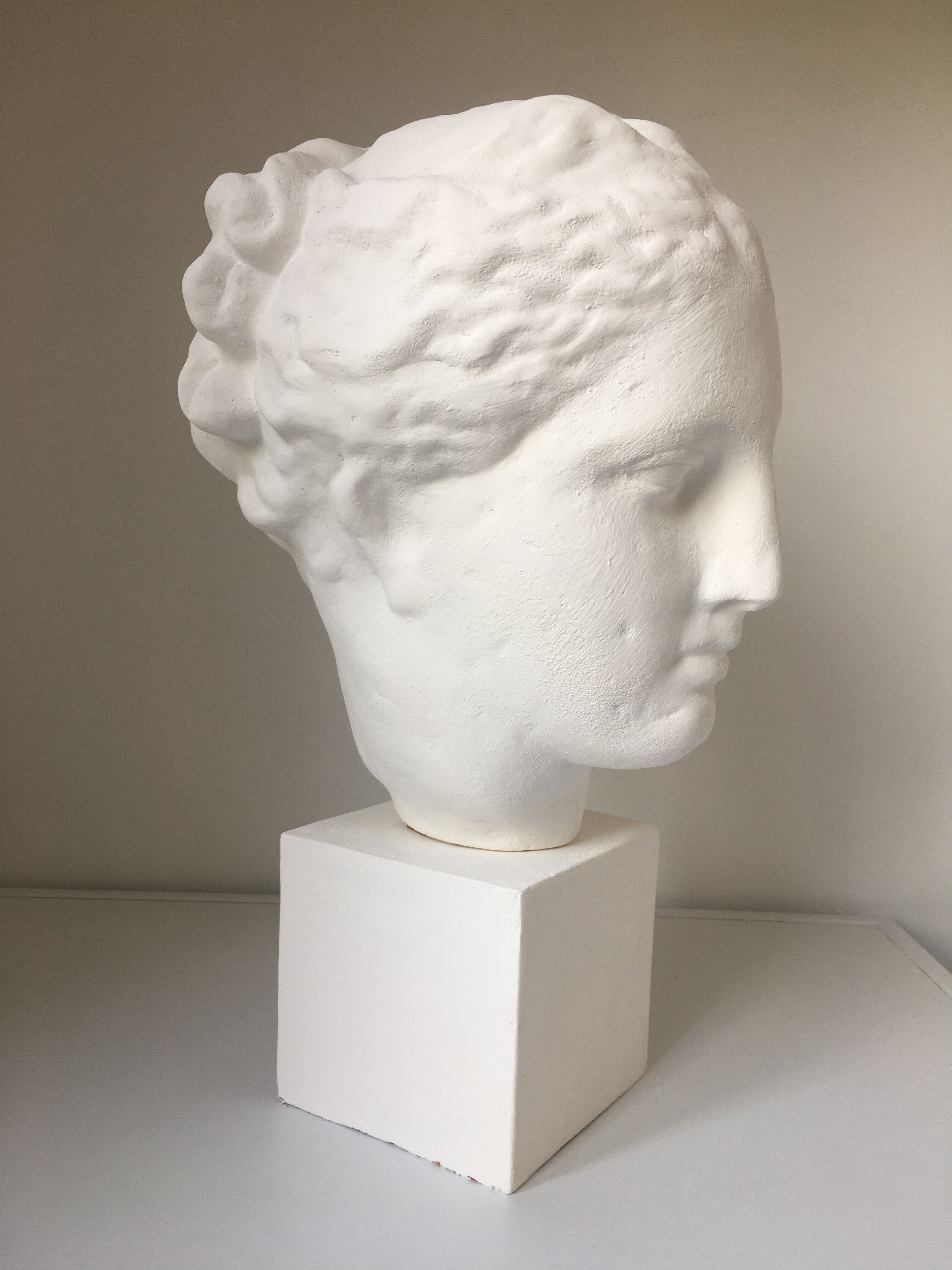 Greek Ap Hygie head. Scopas Hellenistic Greek art in plaster-bleached terracotta