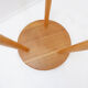 Vintage solid wood side table with rounded legs.