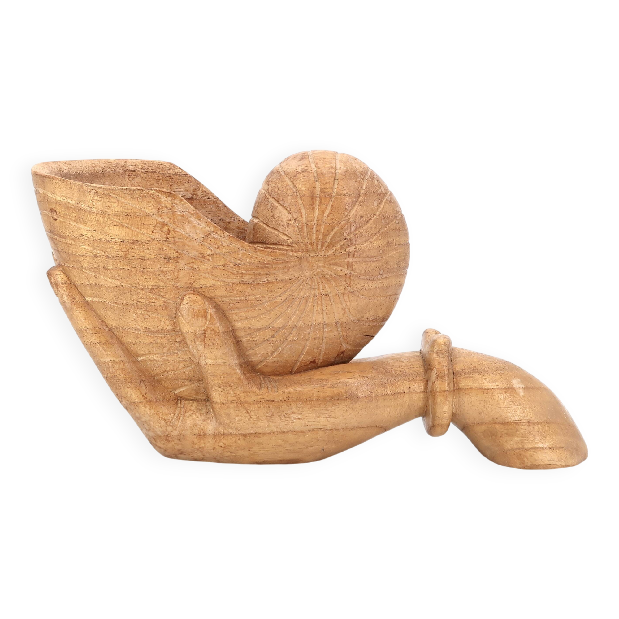 Wooden hand emptier holding a shell, 1970s