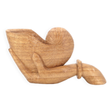 Wooden hand emptier holding a shell, 1970s