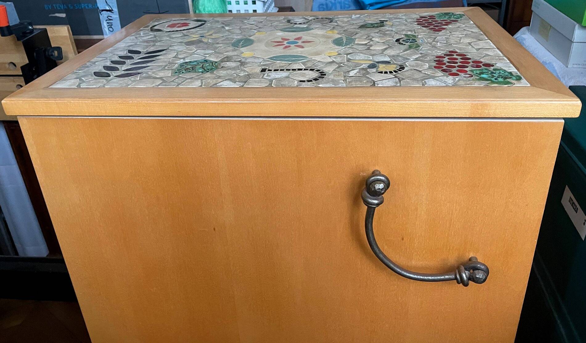 New oak storage furniture with a signed artisanal mosaic top.