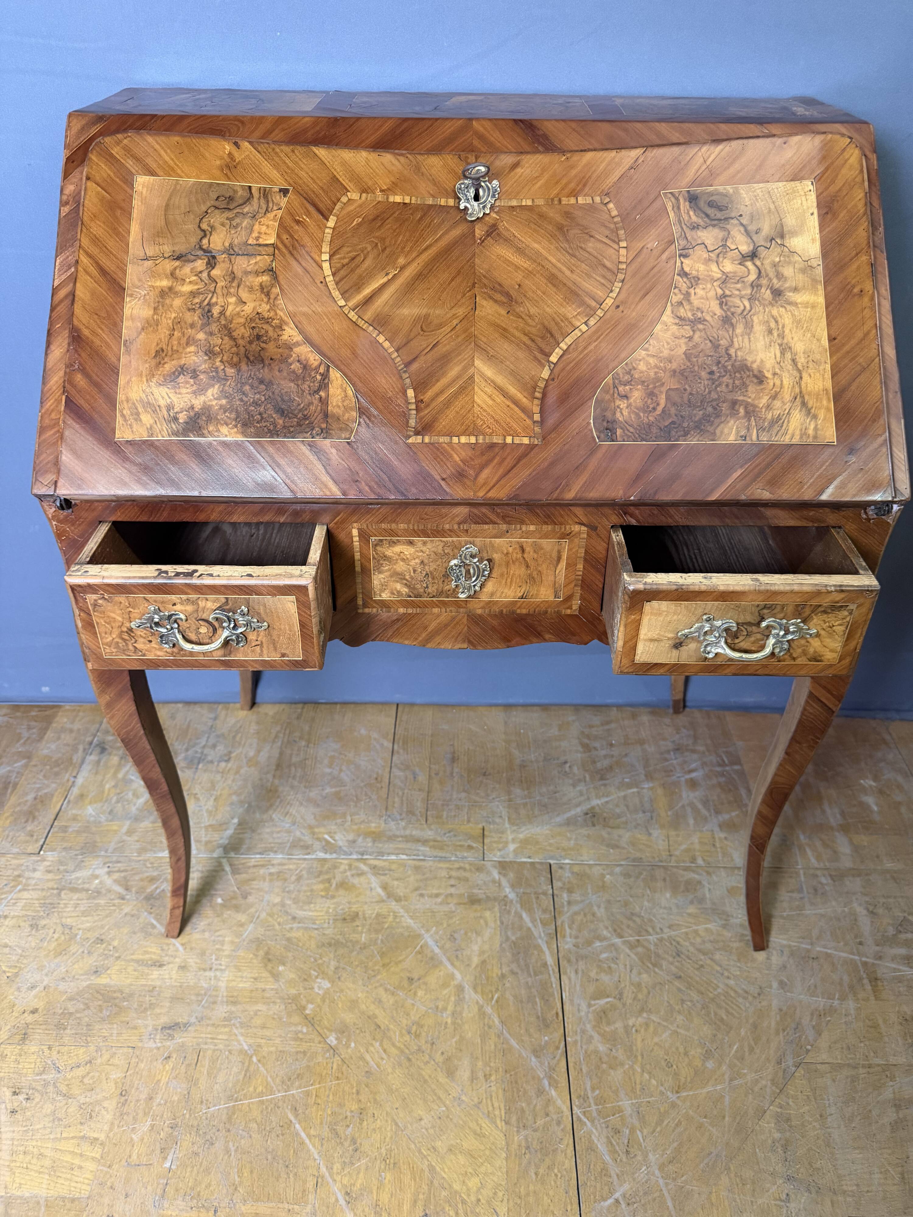 Louis XV slant-top desk in 18th-century marquetry.