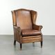 Sheepskin wingback armchair with patina finished with decorative nails