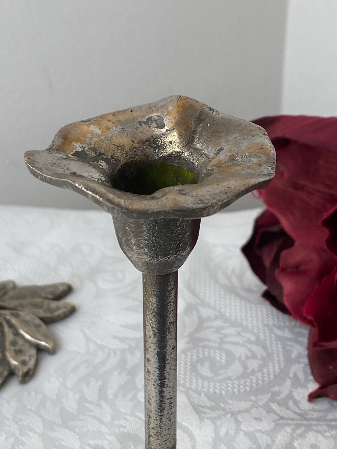 Pair of metal flower candlesticks