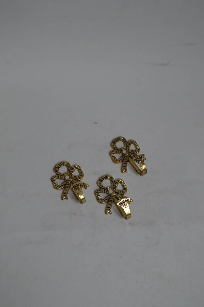 Trio of brass coat hooks