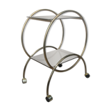 Service console with design / gilded metal wheels and smoked glass
