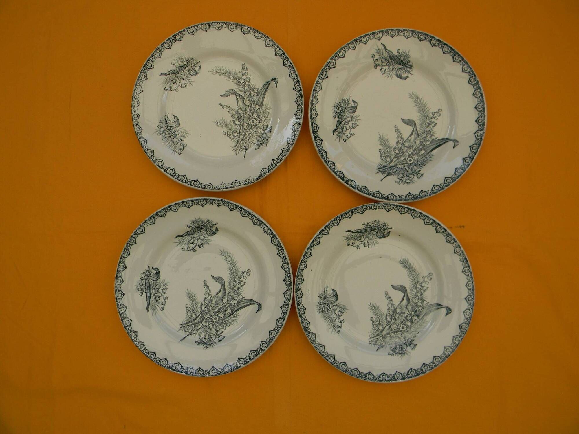 Set of 4 flat plates in saint amand earthenware. lily of the valley decor.