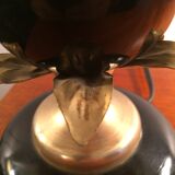 Lampe noire et or à décor de feuilles