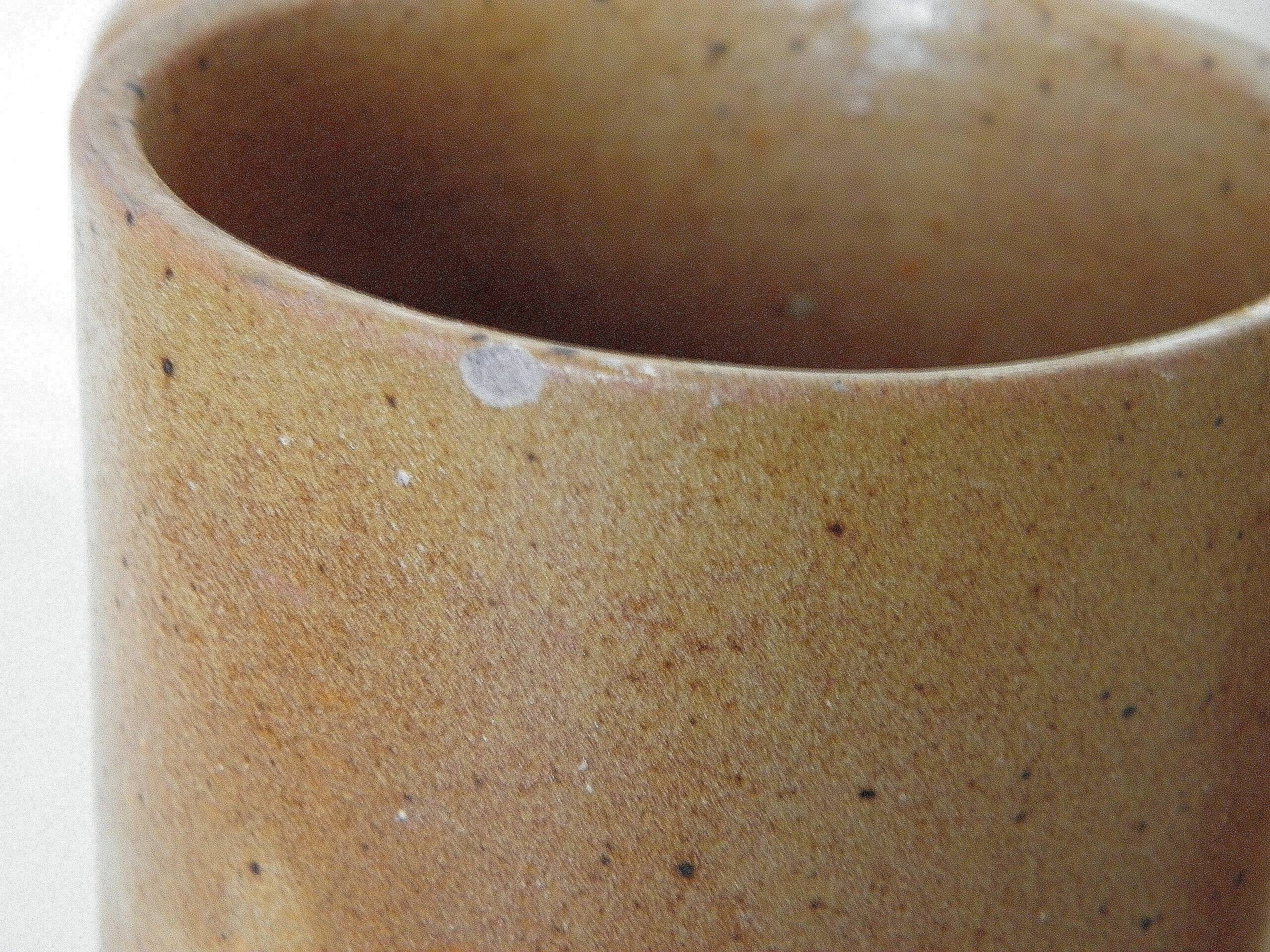 Decanter and enamelled stoneware mugs