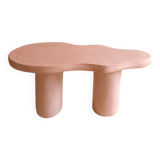 Organic shaped coffee table in pink teracotta tadelakt